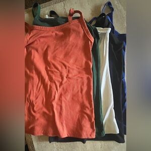 5 pack of No Boundaries Ribbed Tank Top in Coral, green, white, black and blue.